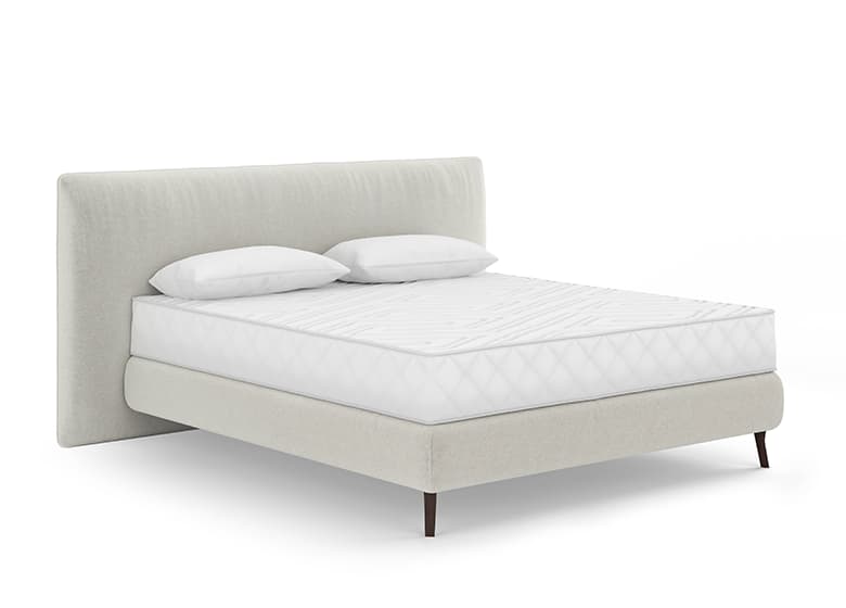 Freisteller eines bodenfreien Boxspringbetts in weiß